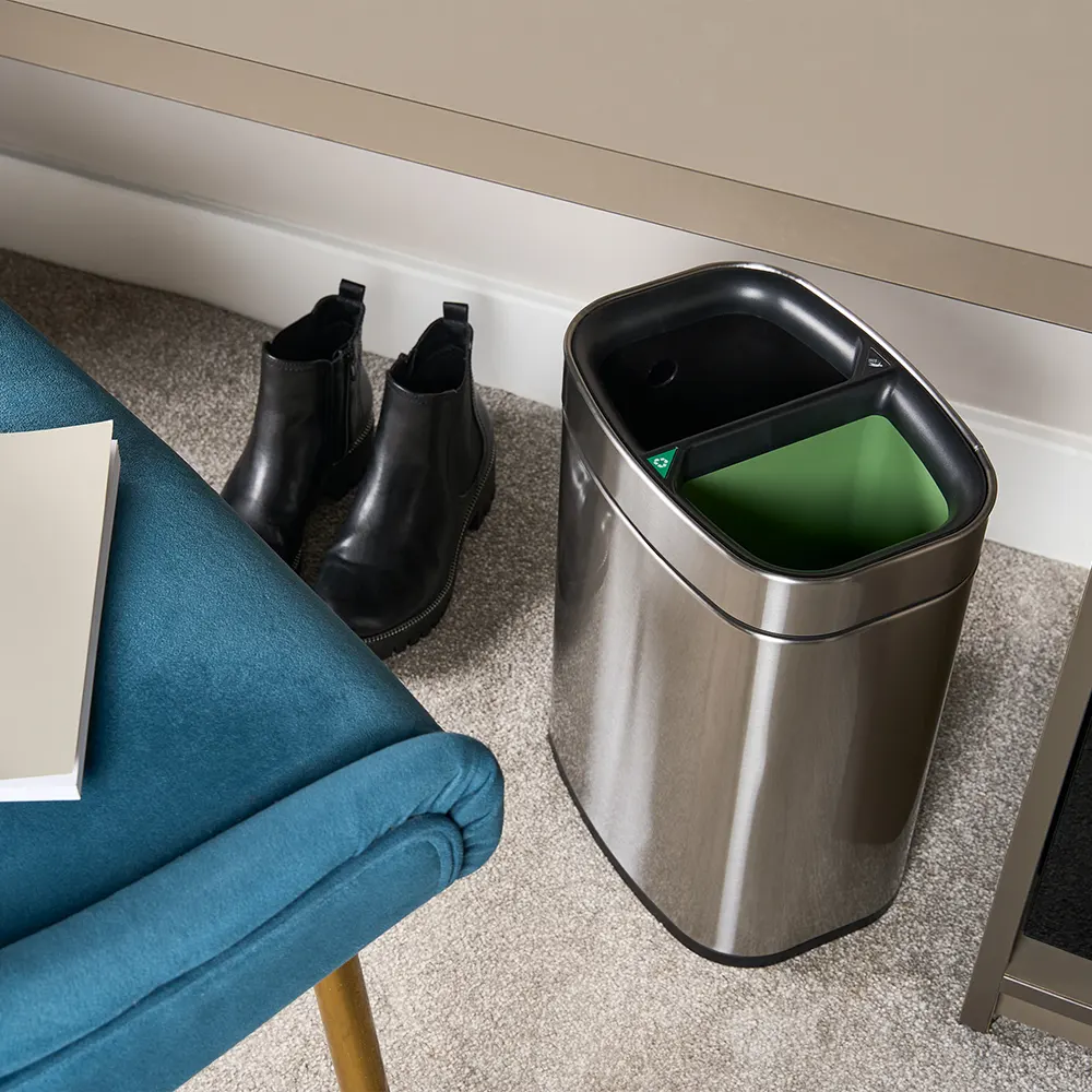 eb6ede_c45aa298ed0d4c339a300dcfc42bb928~mv2 NEWPORT 12L dual recycling bin – brushed steel, angled view in guestroom